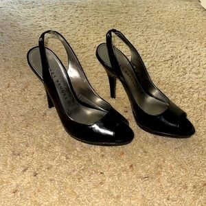 Audrey Brooke black heels very classy with strap for ankle. Perfect condition!